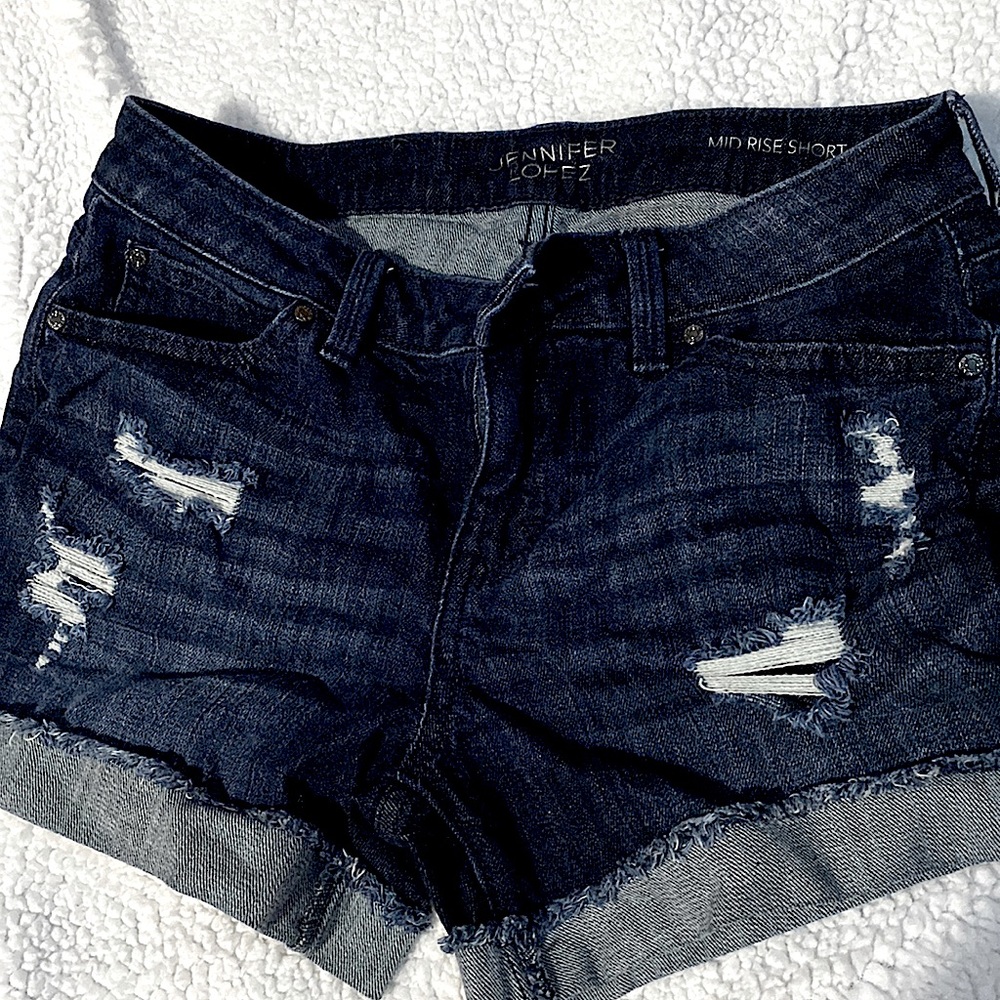 Jennifer Lopez brand shorts. Size 2 mid-rise. Medium/Dark wash, never worn.